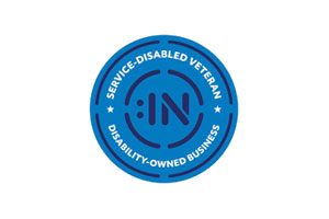 Service-Disabled Veteran Disability-Owned Business circular certification badge with text shown in circular orientation and with Disability:IN icon logo in center.