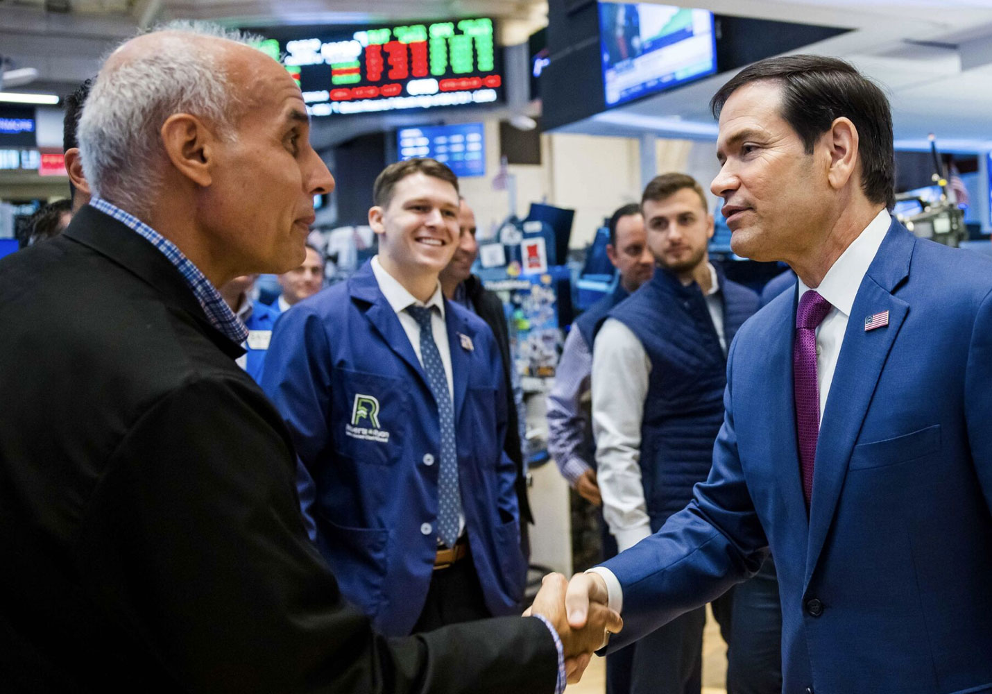 Secretary of State Marco Rubio greets Roberts and Ryan employees on NYSE floor.